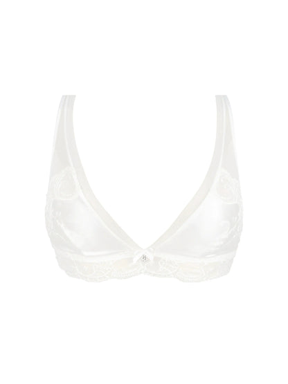 White bikini top on a light beige background