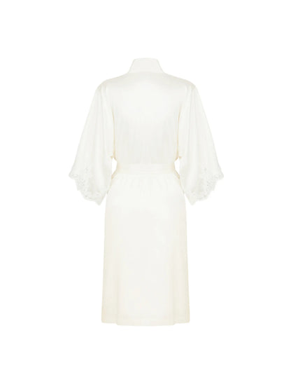 White dress with sheer sleeves on a white background
