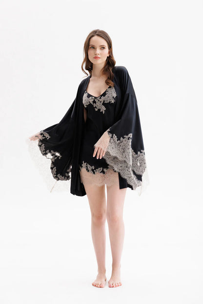 Woman wearing a black lace silk nightgown with spaghetti straps and matching kimono (sold separately). Showing the full figure picture